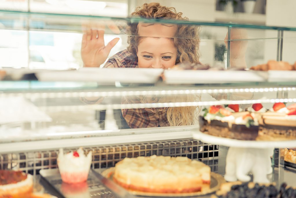 Woman choosing pastries in a store